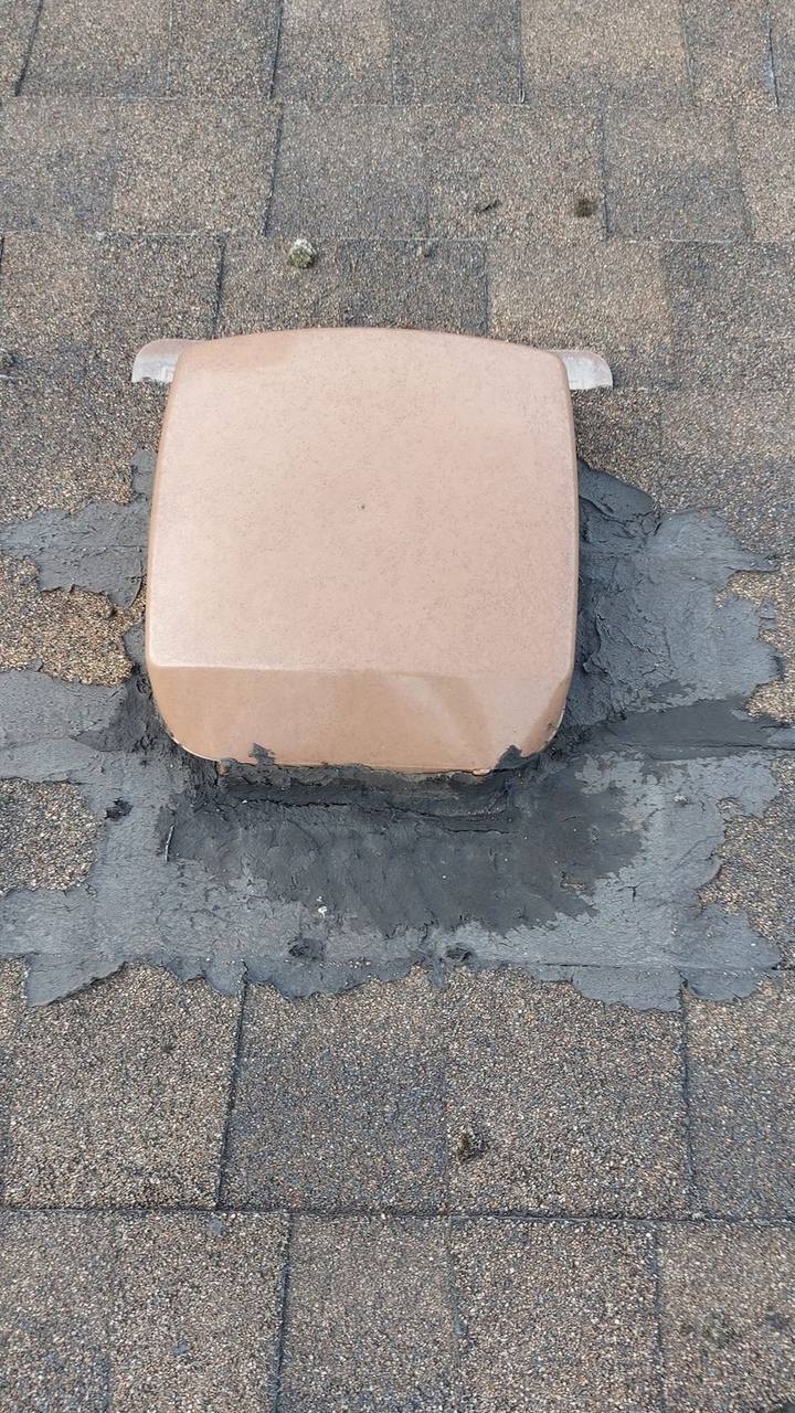 Failed tarred roof vent repair showing excessive mastic around a static box vent on aging asphalt shingles, identified during a Fraser Roofing inspection in the Fraser Valley