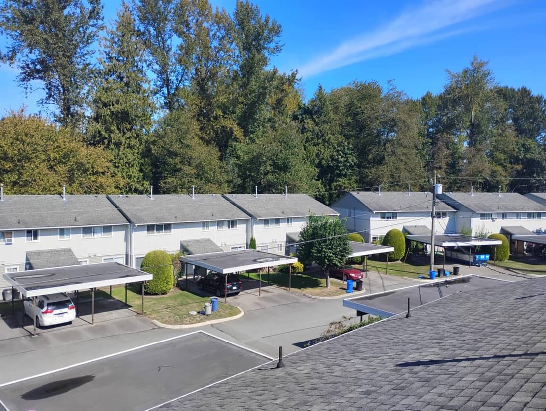Completed multi-complex roofing project in Chilliwack by Fraser Roofing showing multiple residential units with new architectural shingles