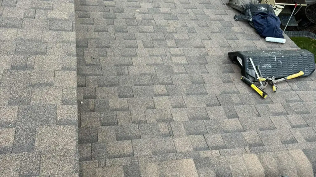 Overhead view down a finished shingled roof onto a backyard below. Fraser Roofing